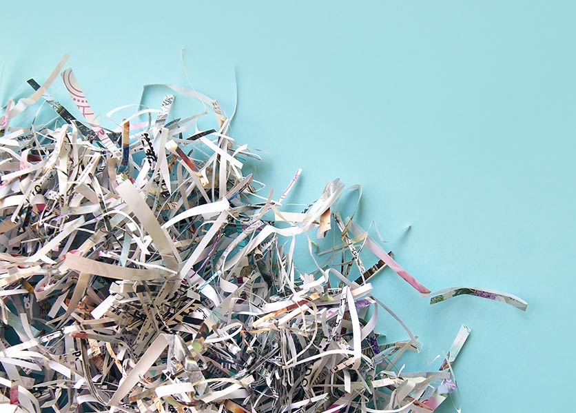 Shredded paper on a blue background